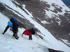 Fabio and Barry downclimb some steep snow and ice on the North Face....