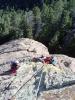 Kristin and Peter hang out at the belay ledge between the second and third ...