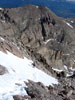 Fabio climbs the last bit of snow to Meeker's summit ridge. Mount Lady Wash...