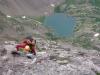 Me scrambling up the ledges with Upper South Colony Lake far below....