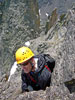Me belaying Fabio on the fifth pitch. The famous Petit Grepon is visible be...